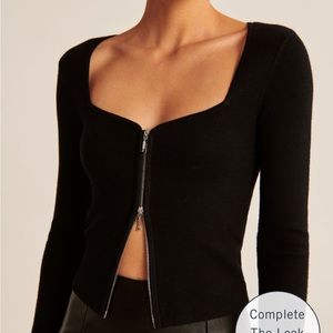 Black zip-up notch neck top